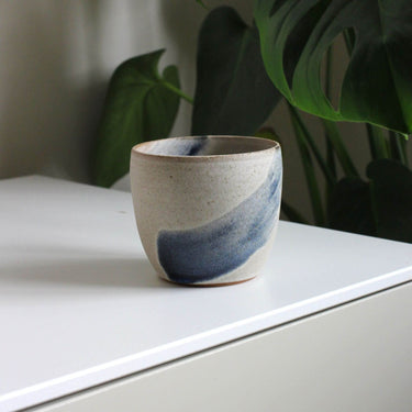 Ceramic flat white cup with blue brushstroke