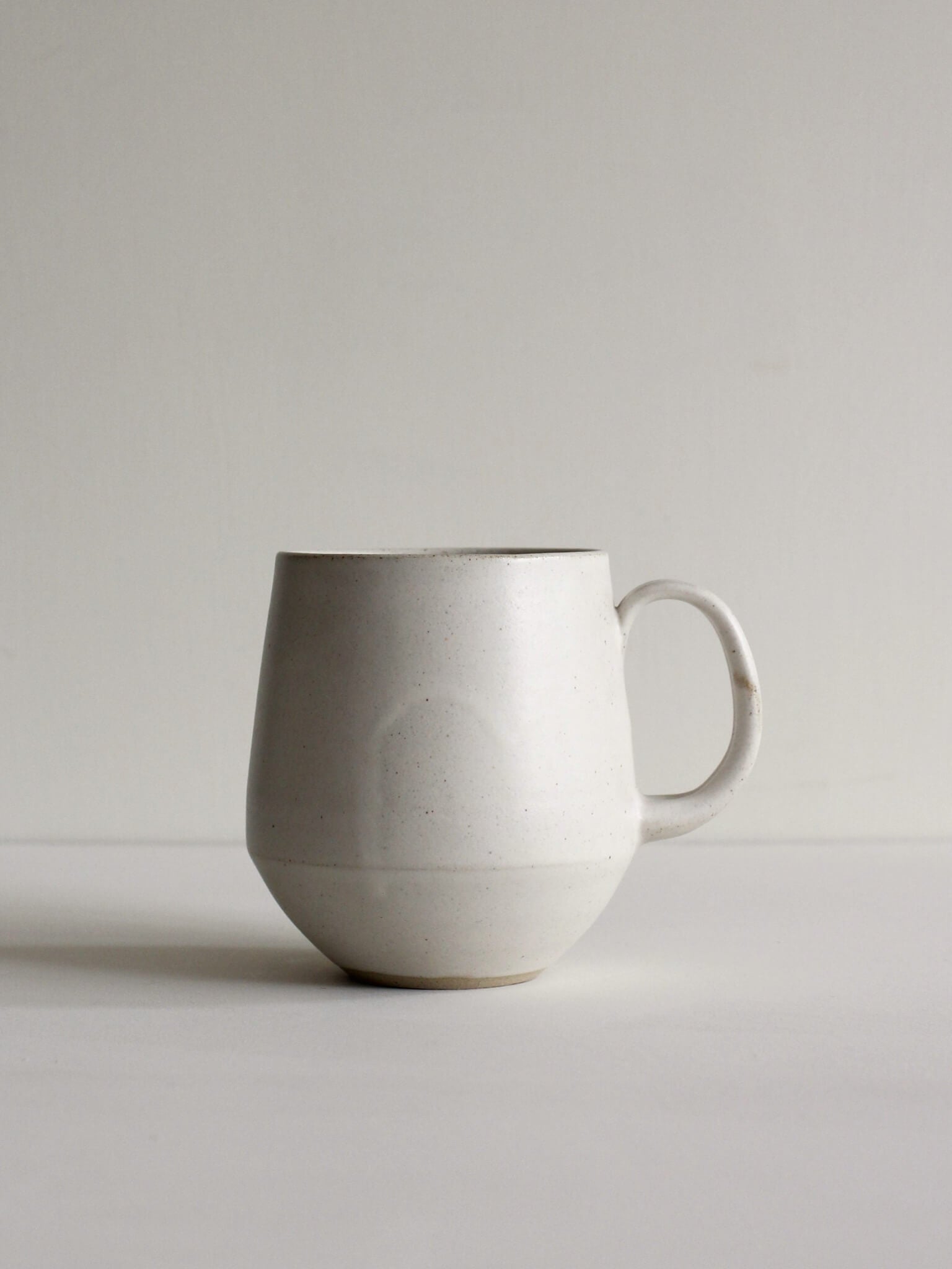 Large white ceramic mug by Clare Spindler