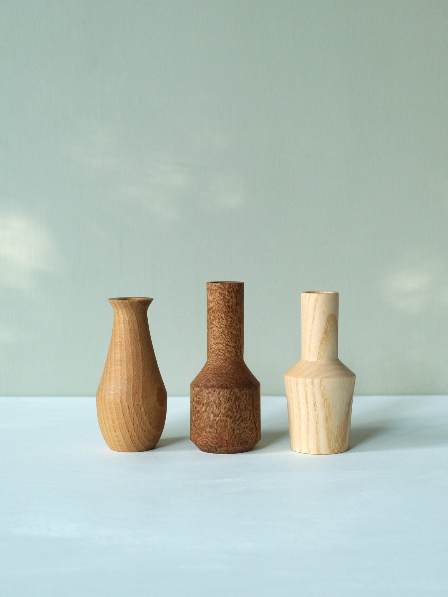 Trio of mini wooden vases
