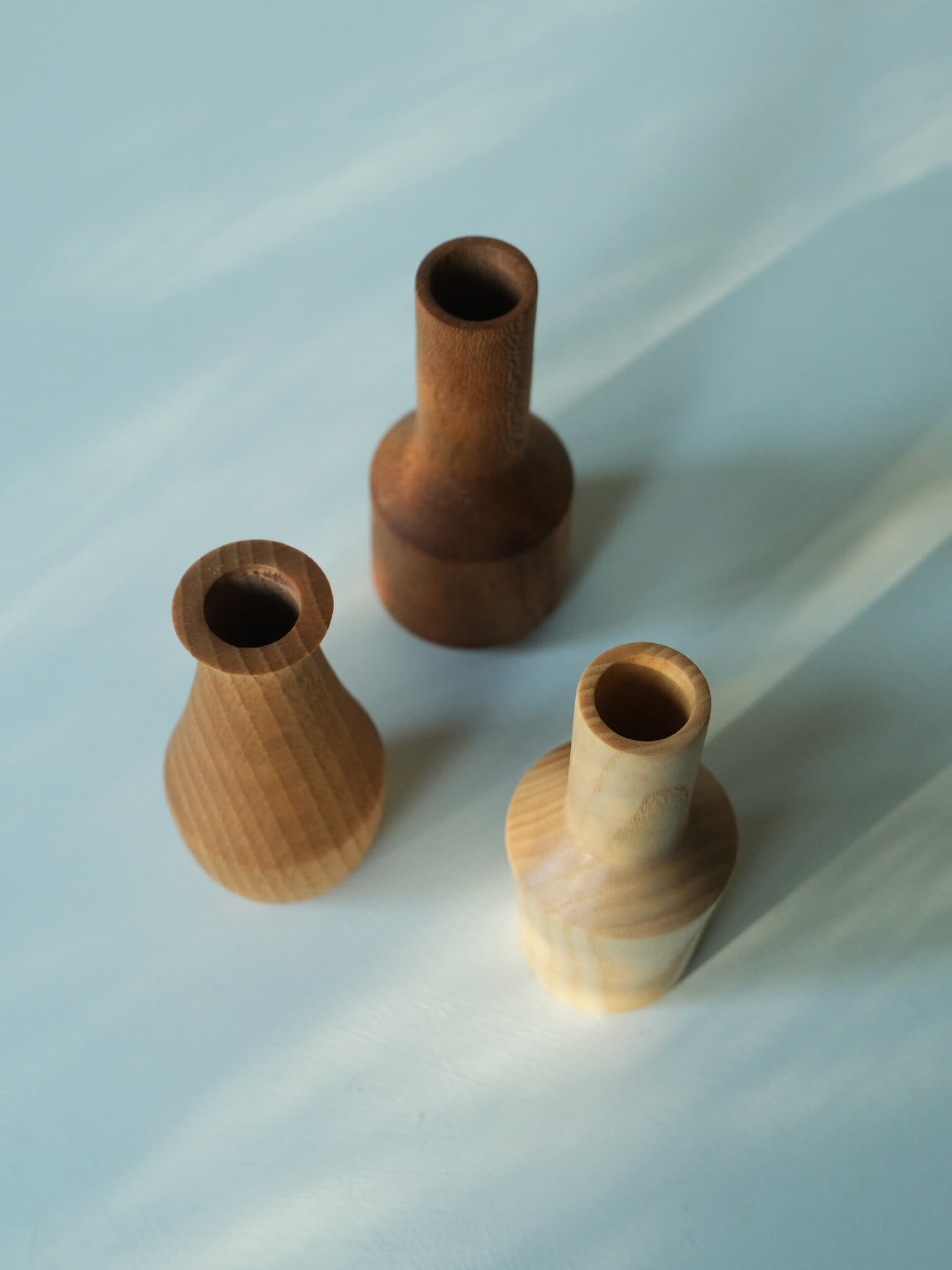 Trio of mini wooden vases