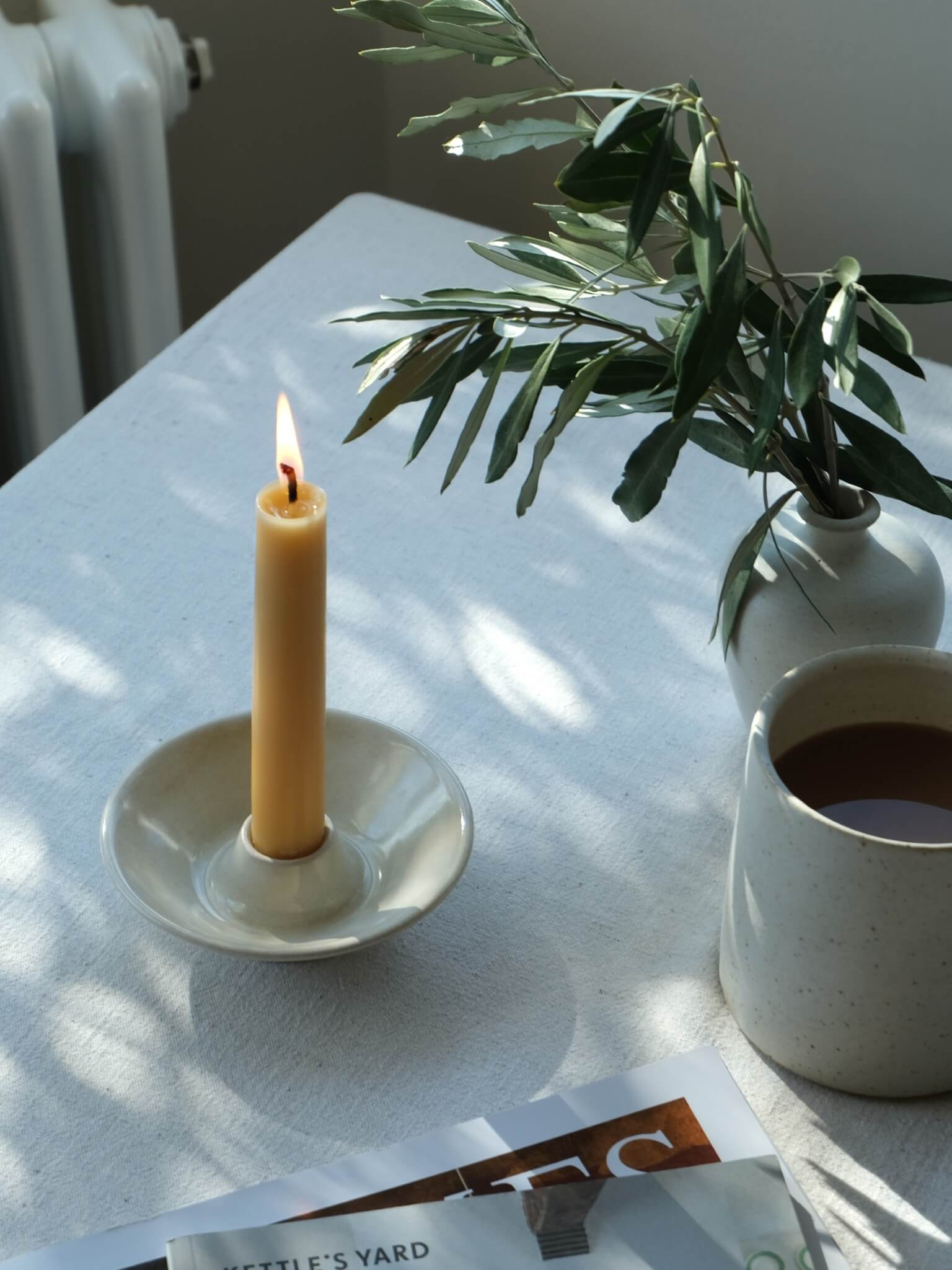 Ceramic candle dish with buttermilk glaze, handmade by Sophia McEvoy