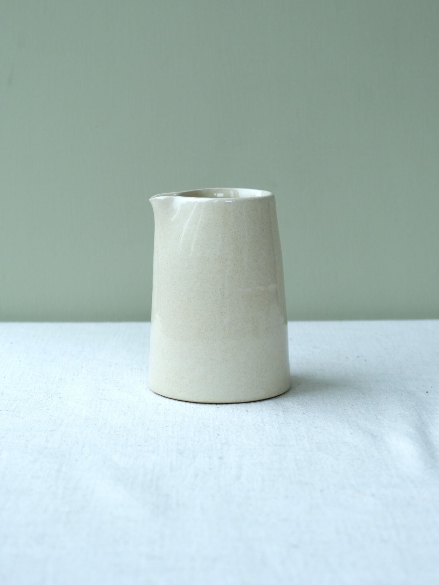 Ceramic milk jug with buttermilk glaze, made by Sophia McEvoy