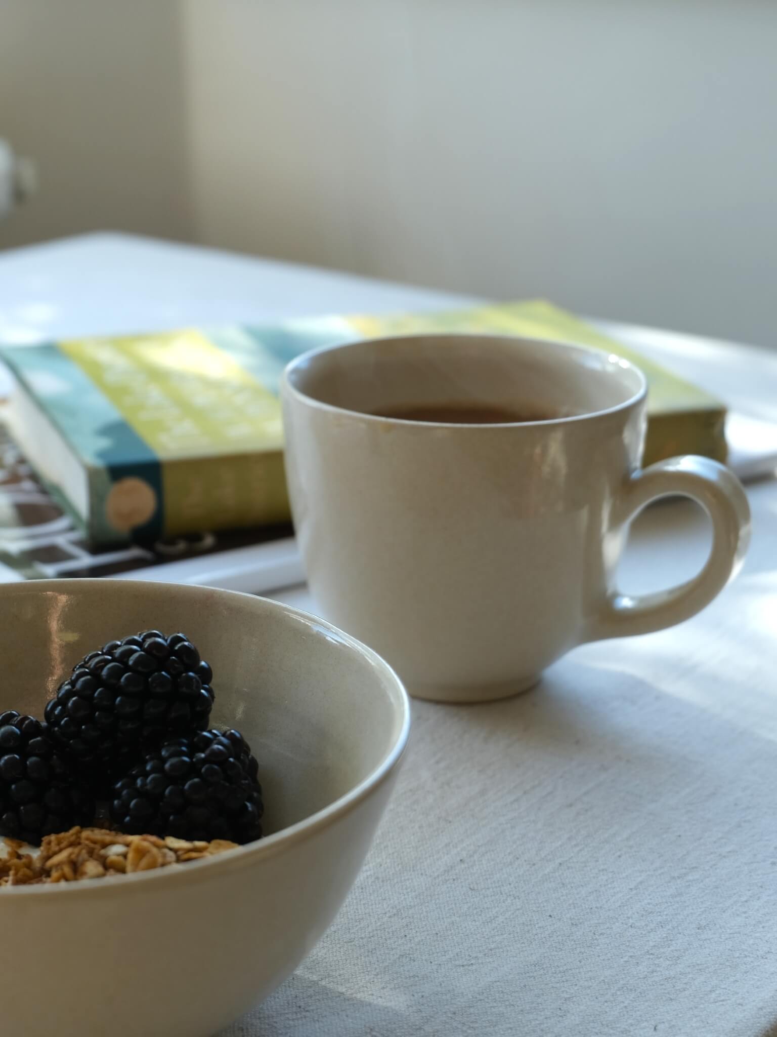 Handmade tea mug with buttermilk glaze, by Sophia McEvoy