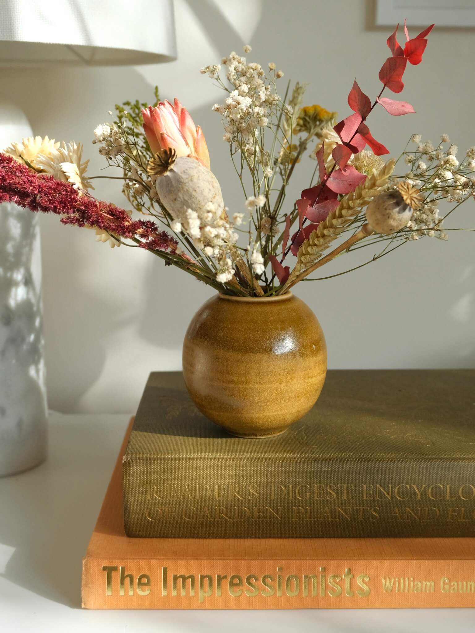 Ceramic orb vase in toffee glaze, by Sophia McEvoy